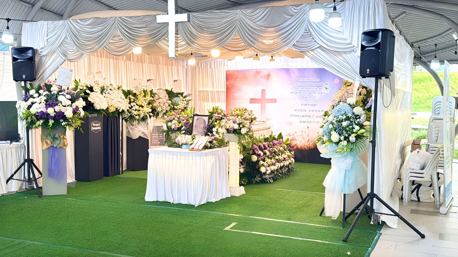 Christian funeral altar set-up with a floral cross, arranged by Farewell Funerals